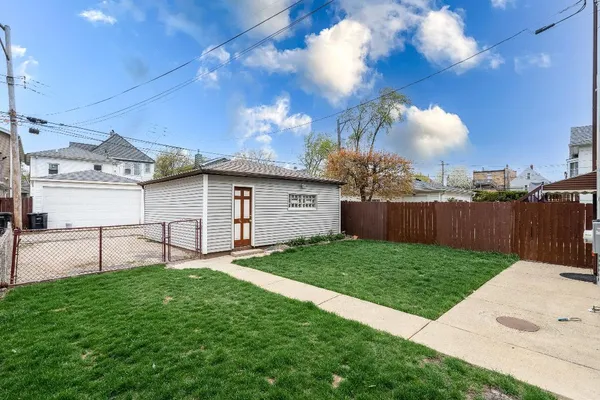 a view of a backyard with a garden