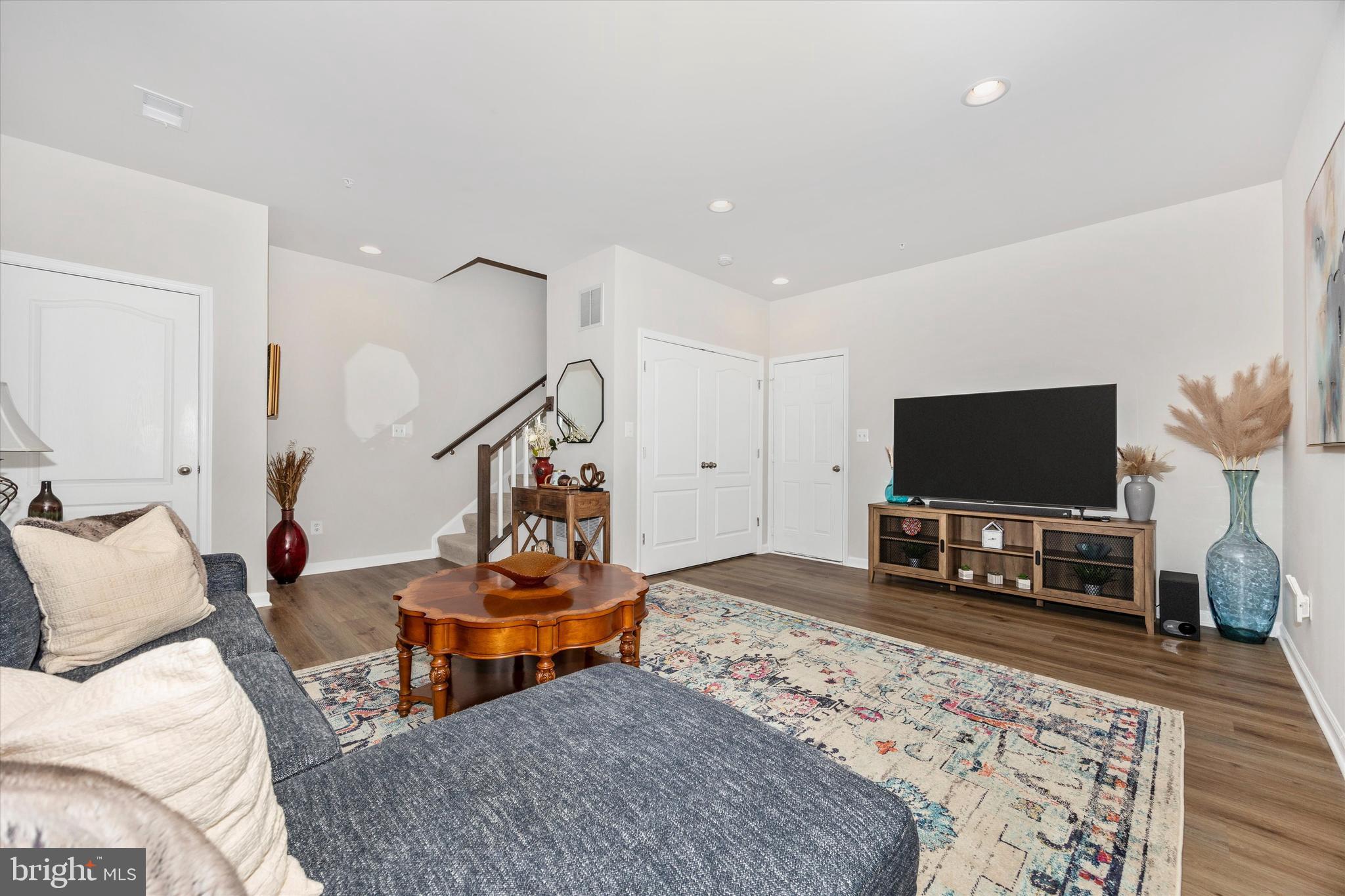 1817 Bird Run Frederick, MD 21702 - Photo 23 of 31 a living room with furniture and a flat screen tv