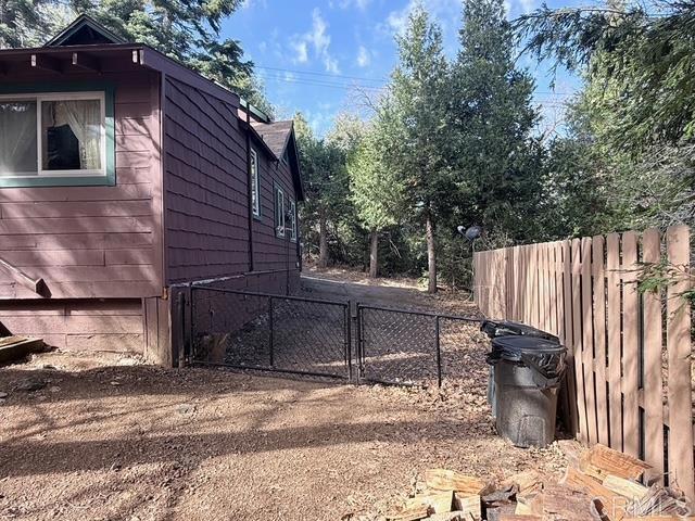 22258 Crestline Road Palomar Mountain, CA 92060 - Photo 49 of 56 a view of a wooden door and a yard in the back