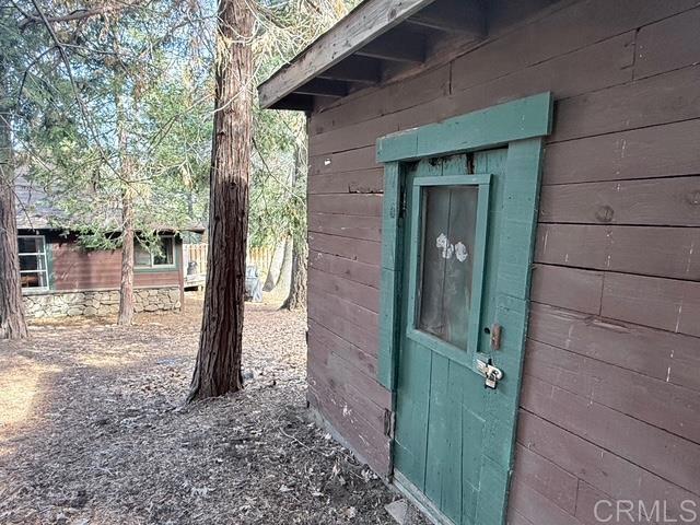 22258 Crestline Road Palomar Mountain, CA 92060 - Photo 51 of 56 a view of a house with a tree in front of it