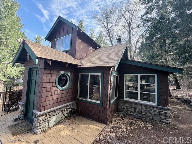 22258 Crestline Road Palomar Mountain, CA 92060 - Photo 54 of 56 a front view of a house with a yard