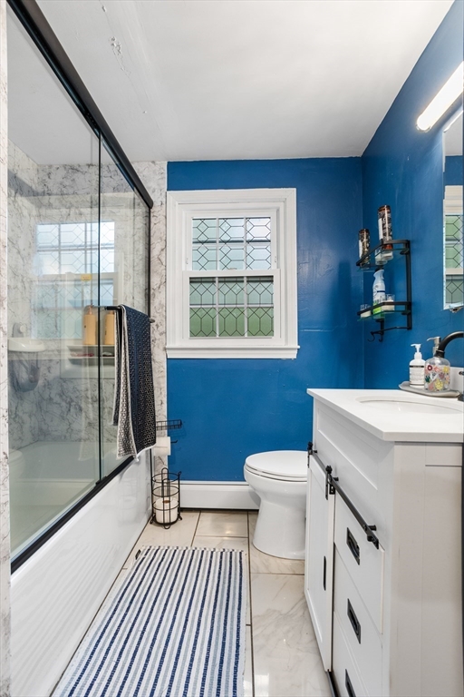 355 Wares Road Ashby, MA 01431 - Photo 18 of 38 a bathroom with a sink a toilet a mirror and next to a window
