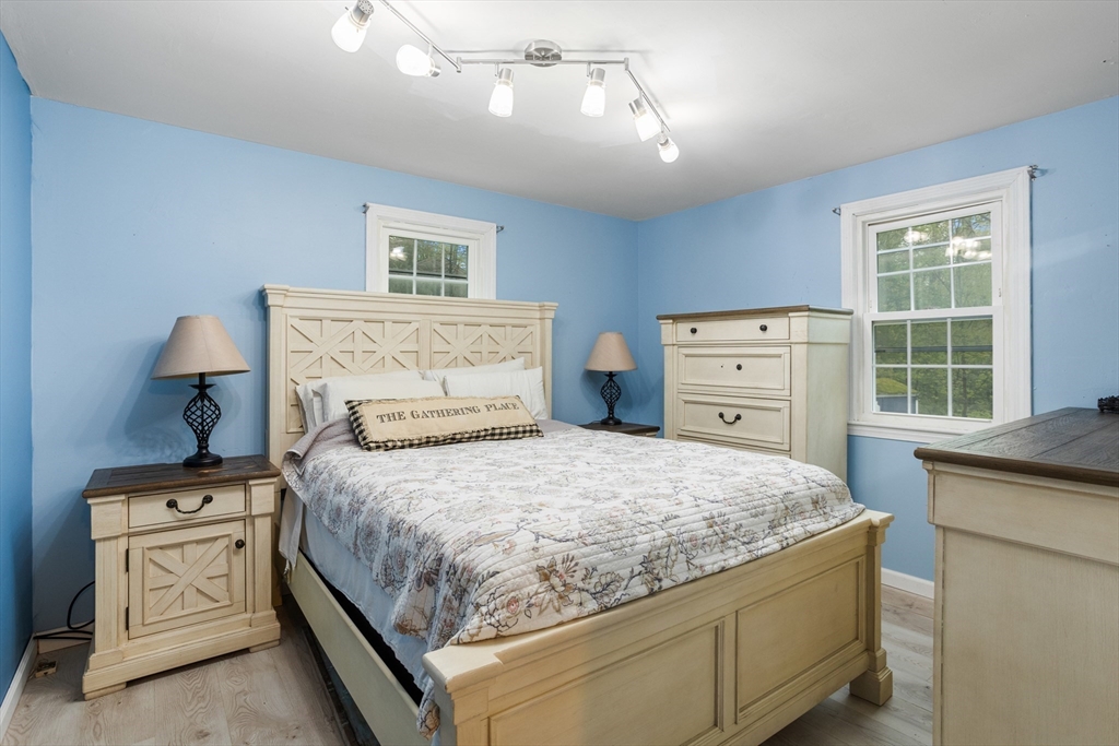 355 Wares Road Ashby, MA 01431 - Photo 19 of 38 a bedroom with a bed and a dresser