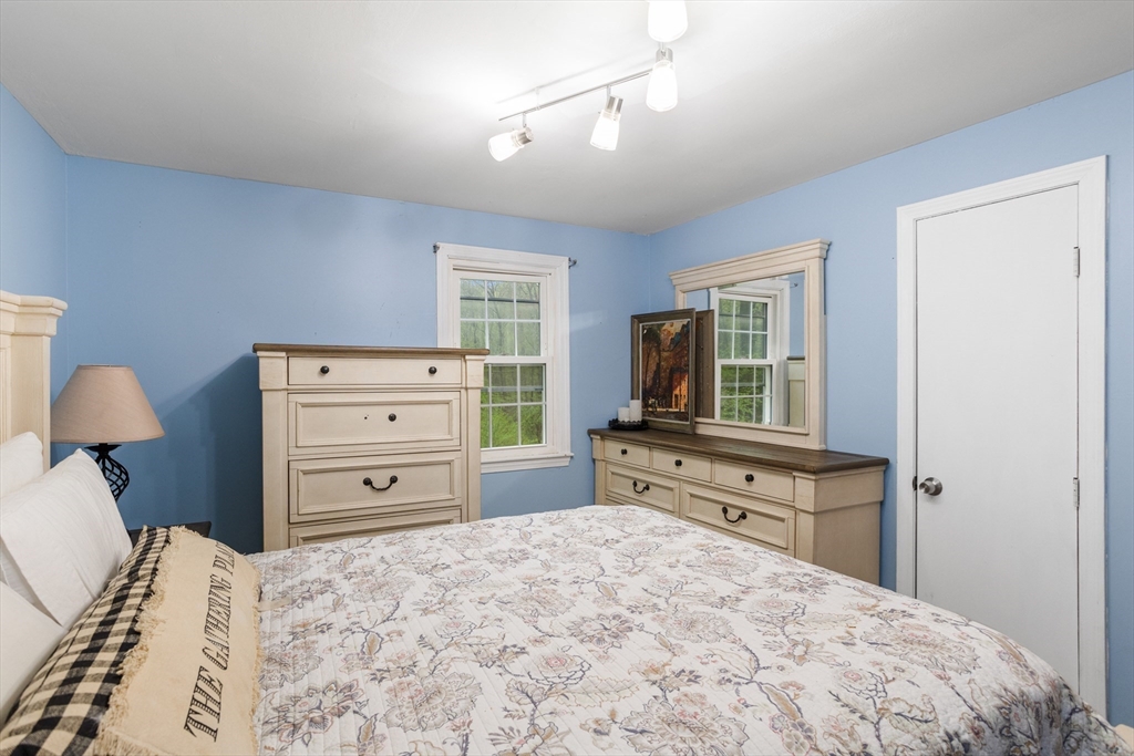 355 Wares Road Ashby, MA 01431 - Photo 20 of 38 a bedroom with a bed and furniture