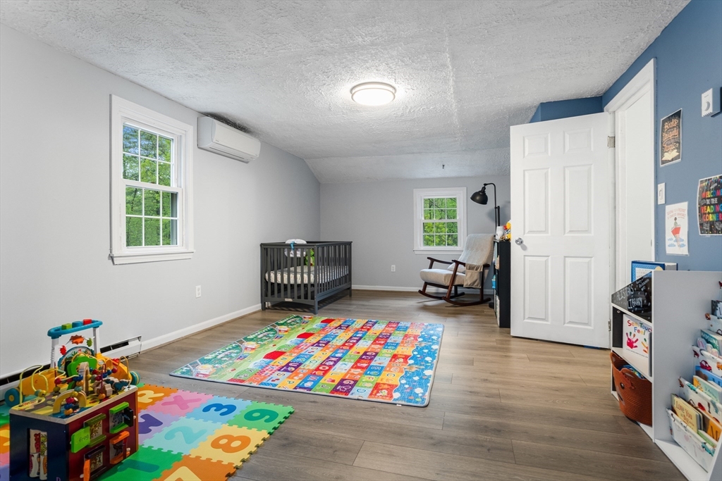 355 Wares Road Ashby, MA 01431 - Photo 21 of 38 a living room with furniture and a wooden floor