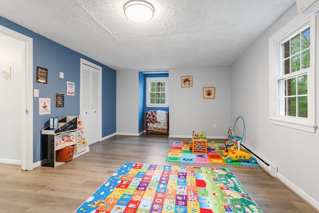355 Wares Road Ashby, MA 01431 - Photo 22 of 38 a room with toys and dresser with wooden floor