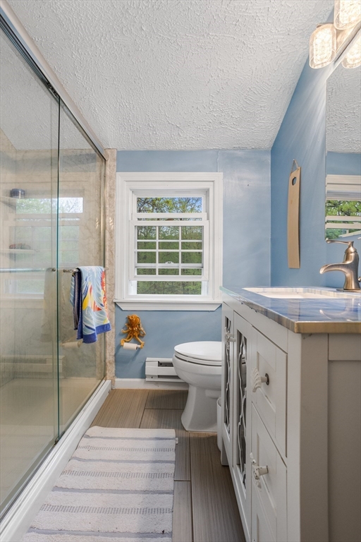 355 Wares Road Ashby, MA 01431 - Photo 24 of 38 a bathroom with a sink a toilet and a shower