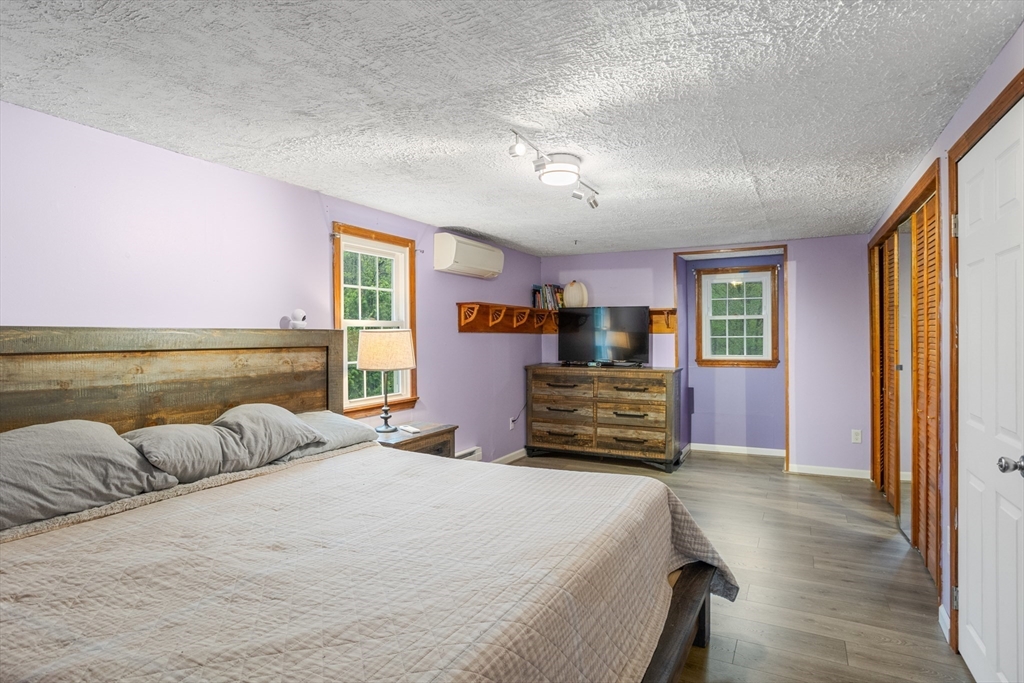 355 Wares Road Ashby, MA 01431 - Photo 26 of 38 a bedroom with a large bed and a dresser