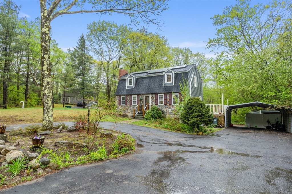 355 Wares Road Ashby, MA 01431 - Photo 3 of 38 a front view of a house with garden