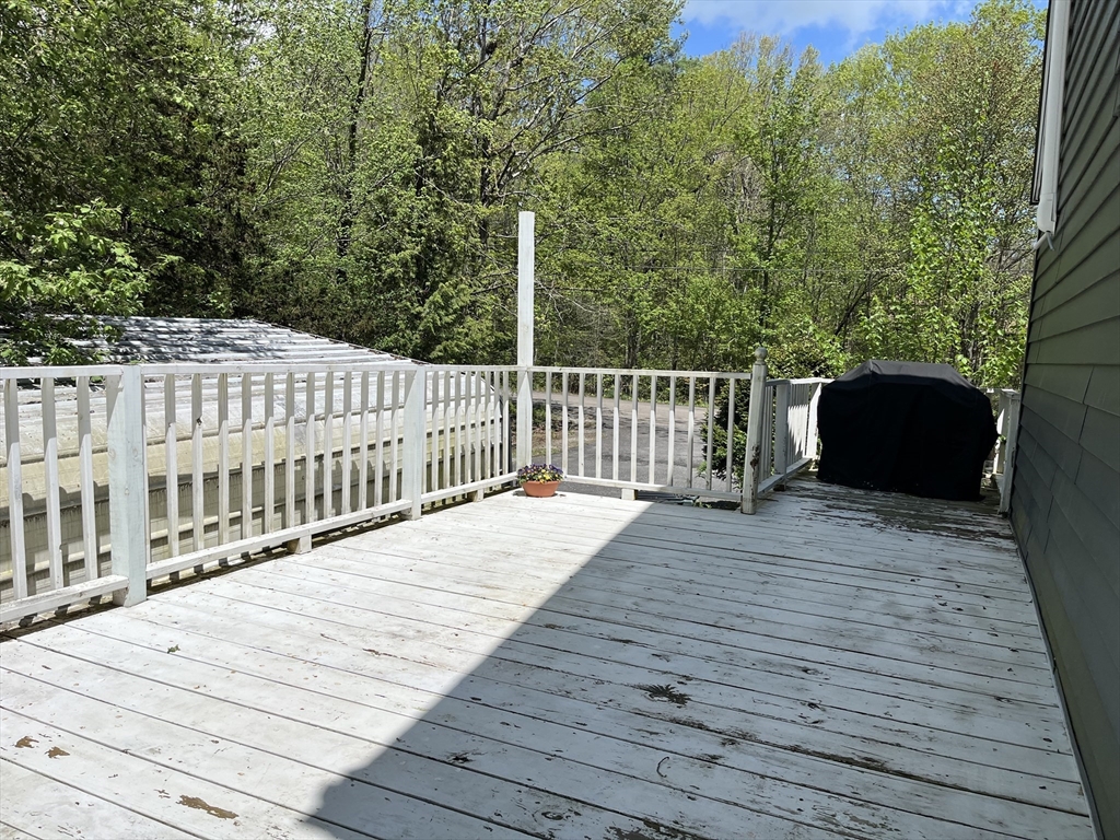 355 Wares Road Ashby, MA 01431 - Photo 33 of 38 a terrace view with wooden floor and fence