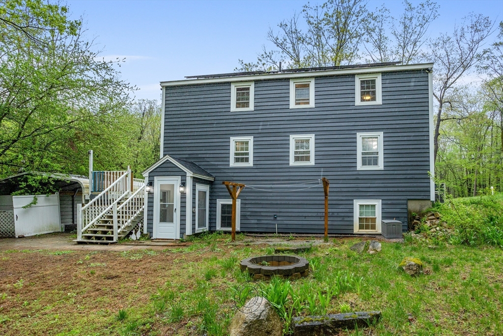 355 Wares Road Ashby, MA 01431 - Photo 34 of 38 a view of a house with a yard and potted plants