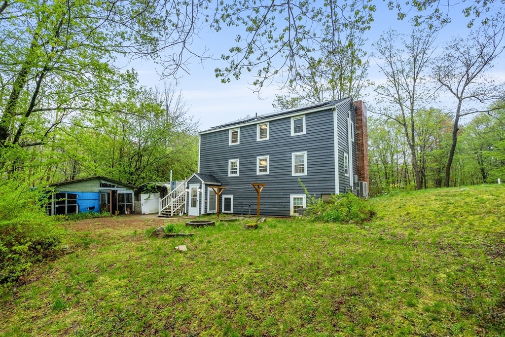 355 Wares Road Ashby, MA 01431 - Photo 35 of 38 a view of a house with a yard