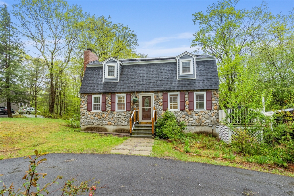 355 Wares Road Ashby, MA 01431 - Photo 4 of 38 a front view of a house with a yard