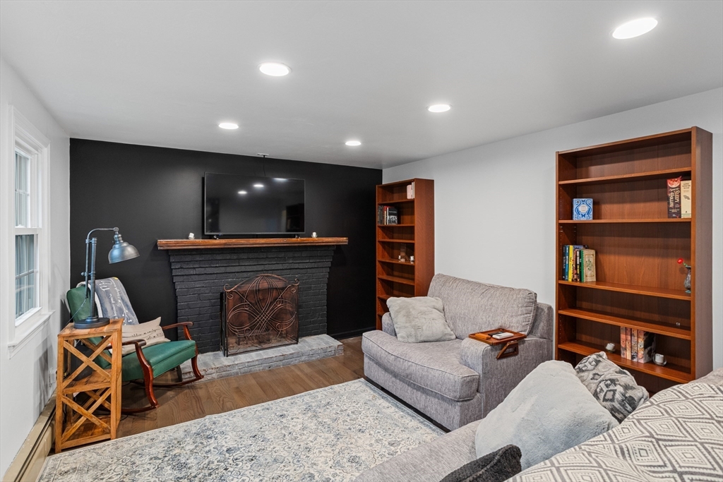 355 Wares Road Ashby, MA 01431 - Photo 6 of 38 a living room with furniture and a fireplace