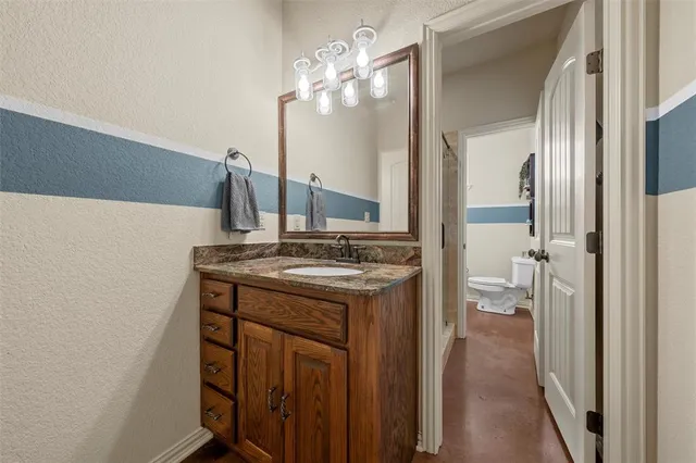 a kitchen with a sink and a refrigerator