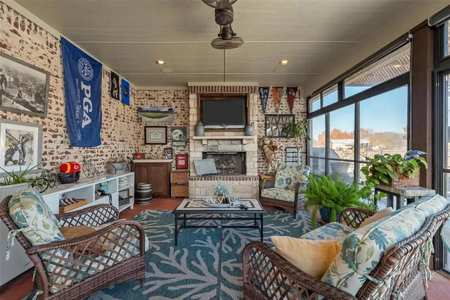 a living room with furniture fireplace and flat screen tv