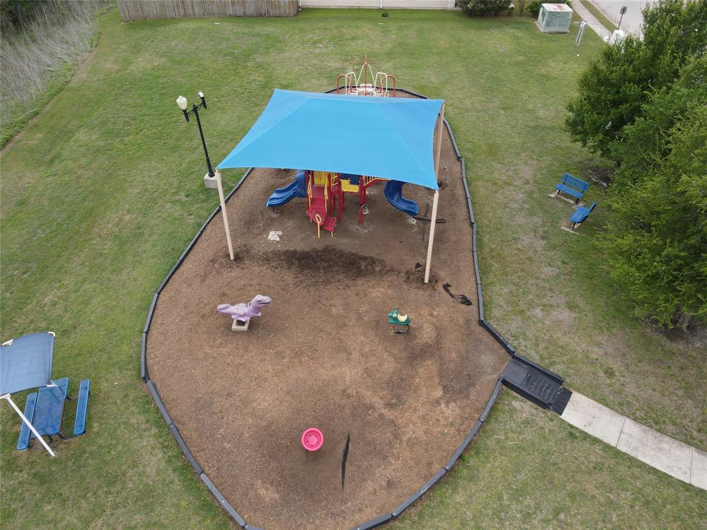 18021 Prairie Verbena Lane Elgin, TX 78621 - Photo 33 of 33 A vibrant playground area offers endless outdoor fun for all ages.