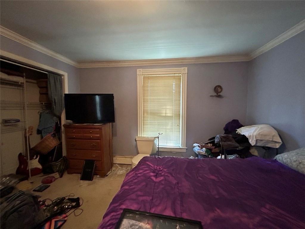343 Malone Ridge Road Washington, PA 15301 - Photo 26 of 50 a bedroom with a bed and wooden floor