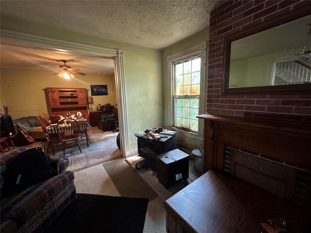343 Malone Ridge Road Washington, PA 15301 - Photo 4 of 50 a living room with furniture and a flat screen tv