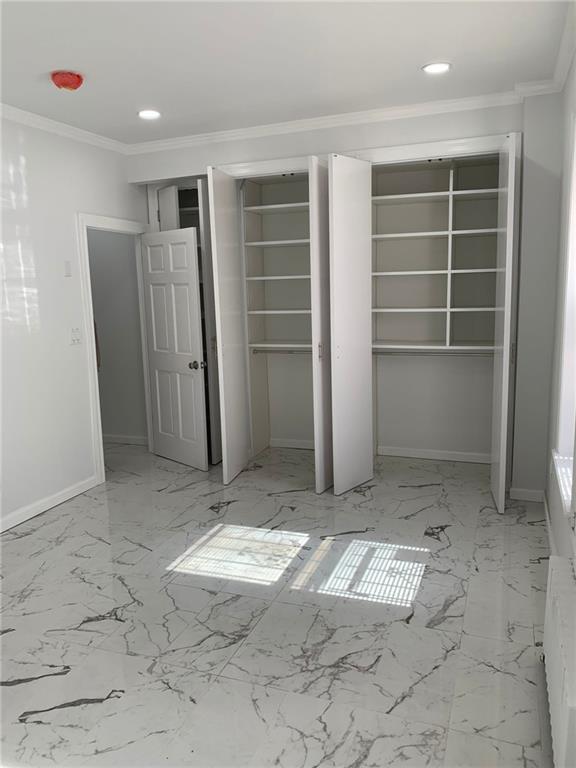 902 East 12th Street Brooklyn, NY 11230 - Photo 5 of 10 a view of an empty room with a window