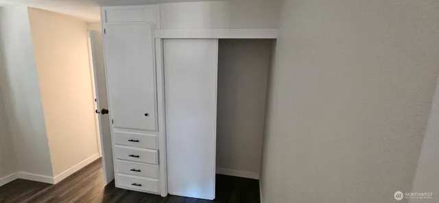 a view of a bathroom with mirror