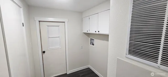 a view of an entryway with a mirror