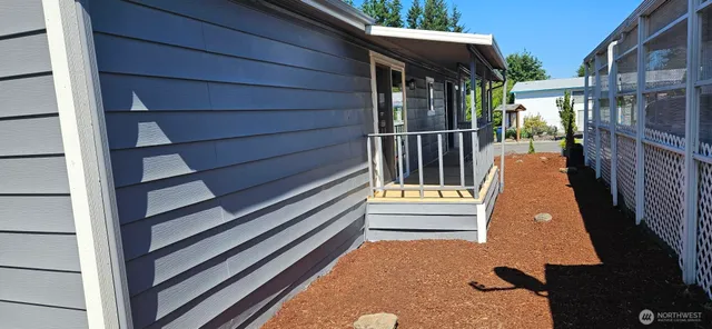 a view of a house with a wooden floor and a window