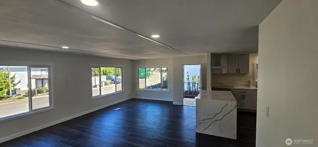 a view of livingroom with furniture wooden floor and windows