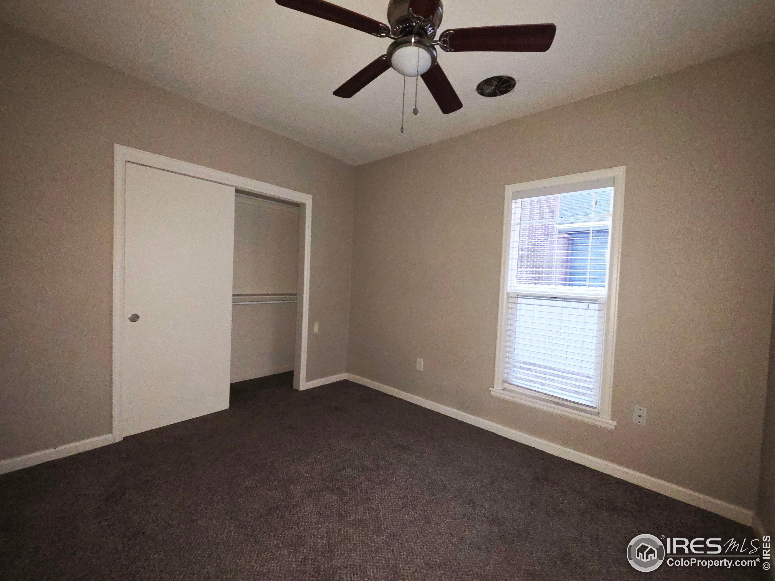 523 Chestnut Street Sterling, CO 80751 - Photo 8 of 13 a view of an empty room with a window