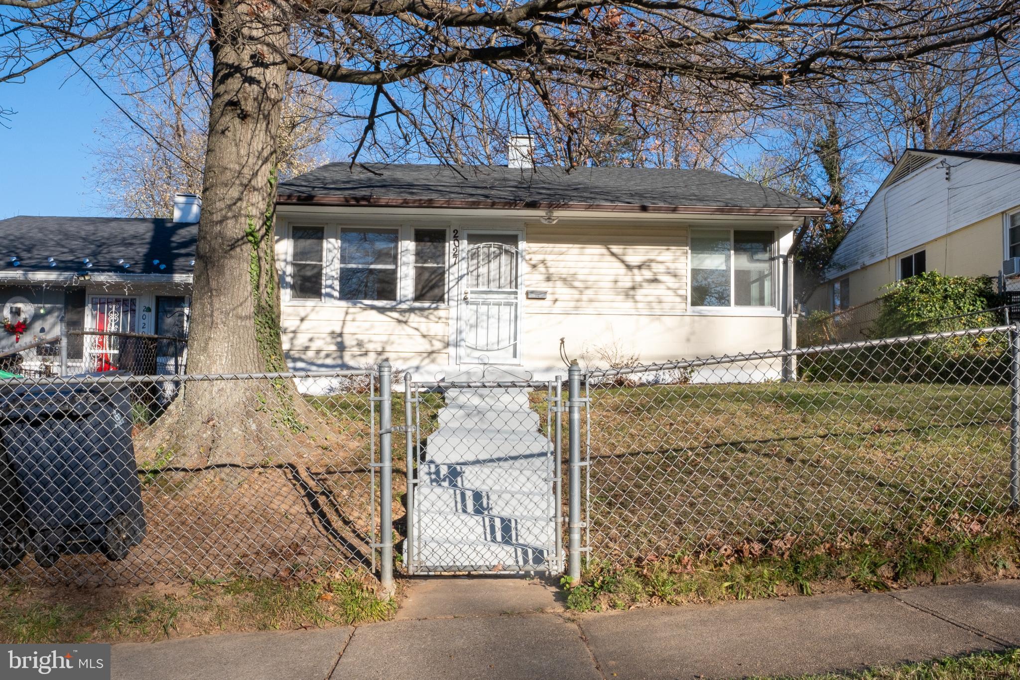 2027 Barlowe Place Landover, MD 20785 - Photo 1 of 20 a front view of a house with a yard