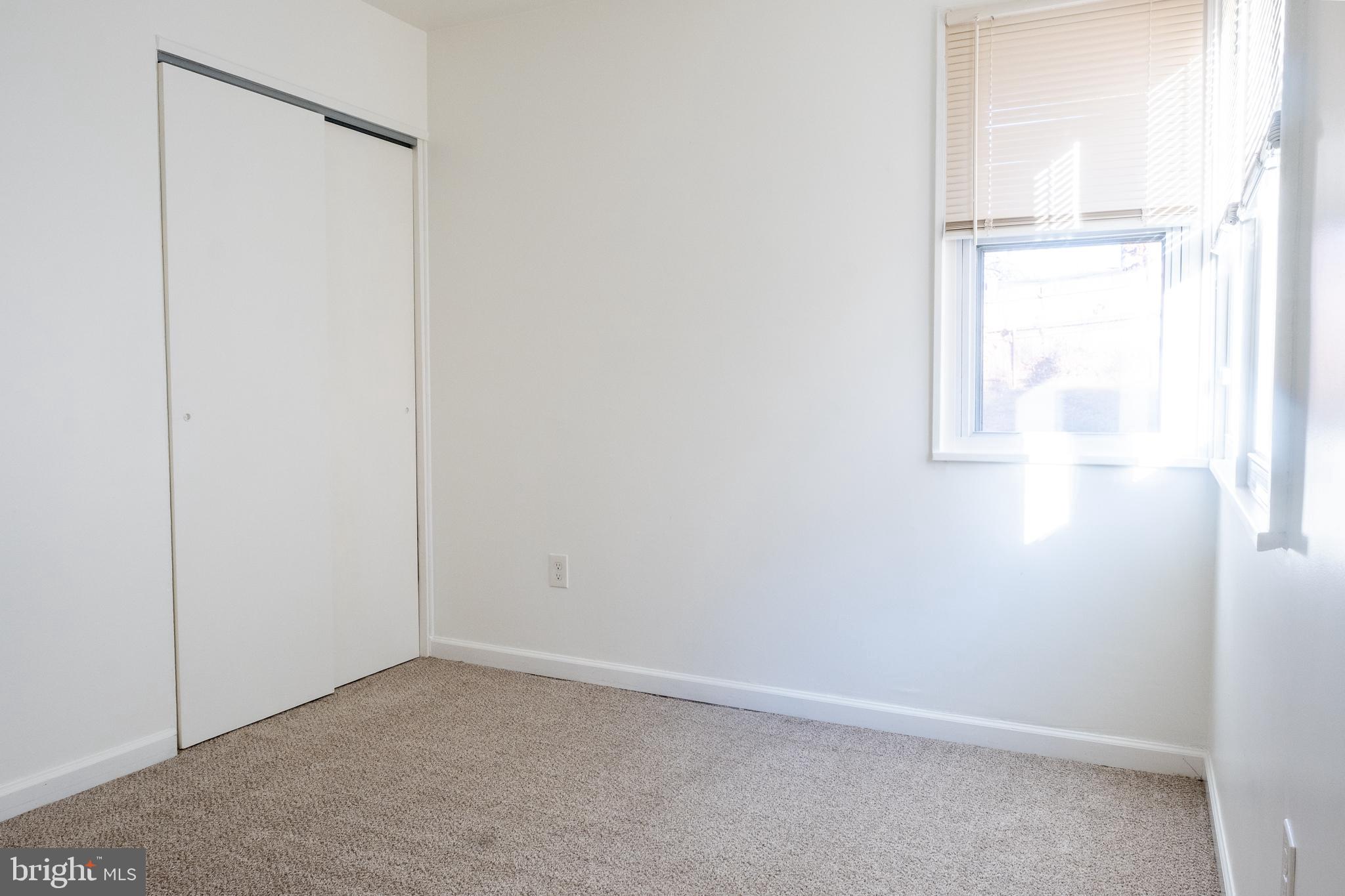 2027 Barlowe Place Landover, MD 20785 - Photo 13 of 20 an empty room with a window