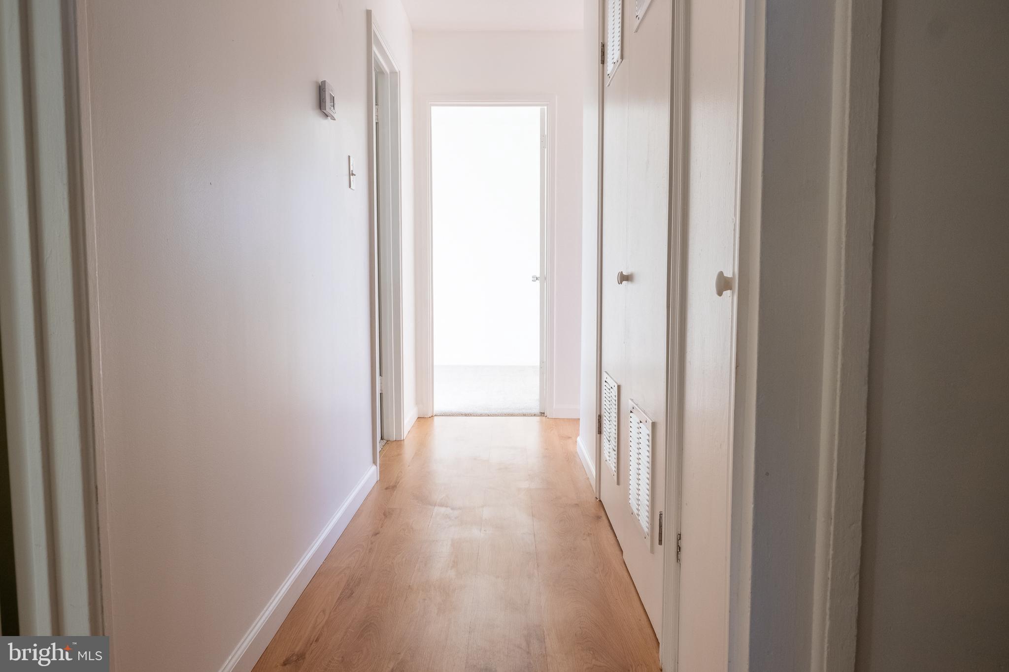 2027 Barlowe Place Landover, MD 20785 - Photo 17 of 20 a view of a hallway with wooden floor