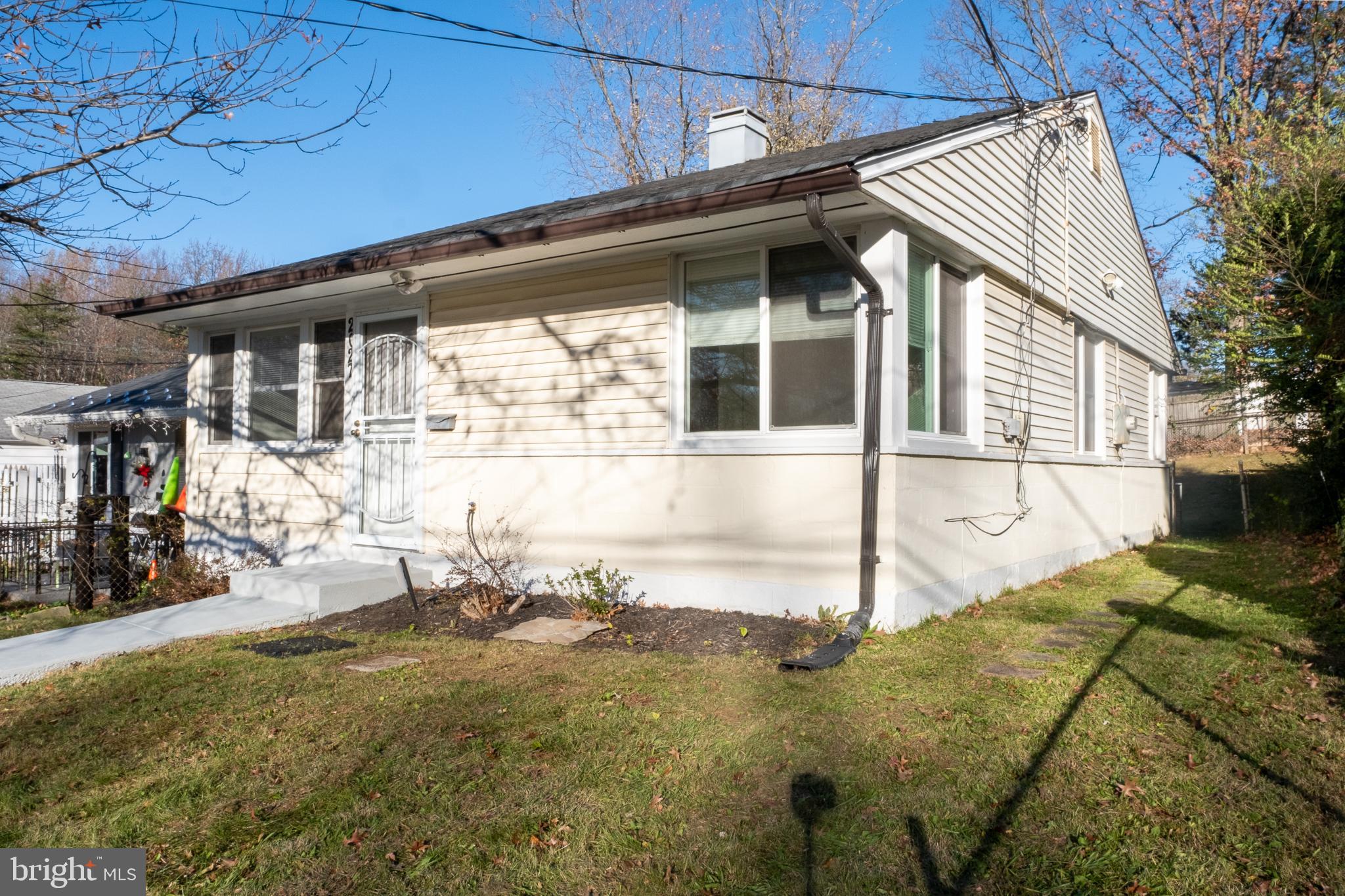 2027 Barlowe Place Landover, MD 20785 - Photo 2 of 20 a front view of a house with a yard
