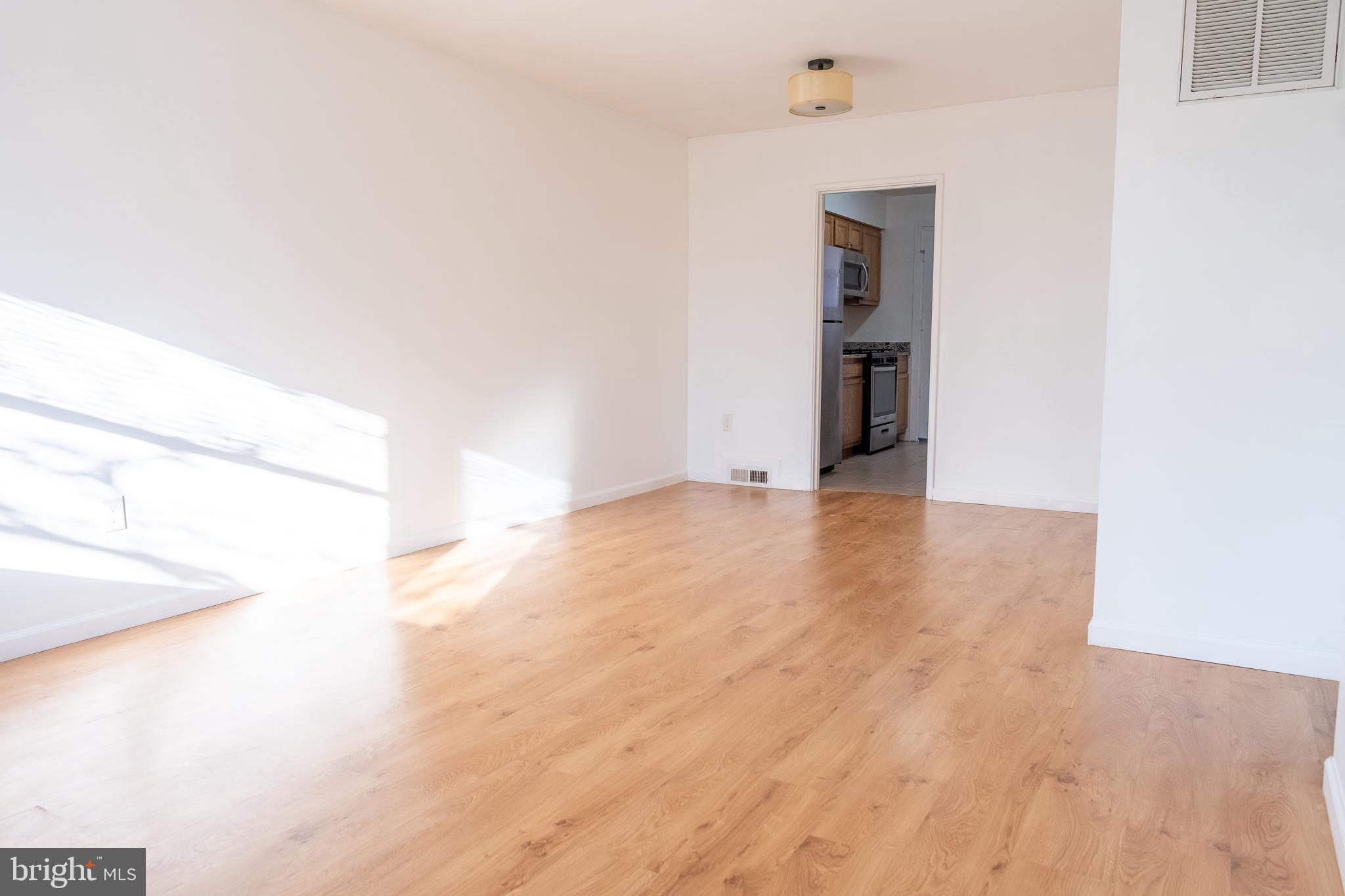 2027 Barlowe Place Landover, MD 20785 - Photo 4 of 20 a view of a hallway with wooden floor and entryway
