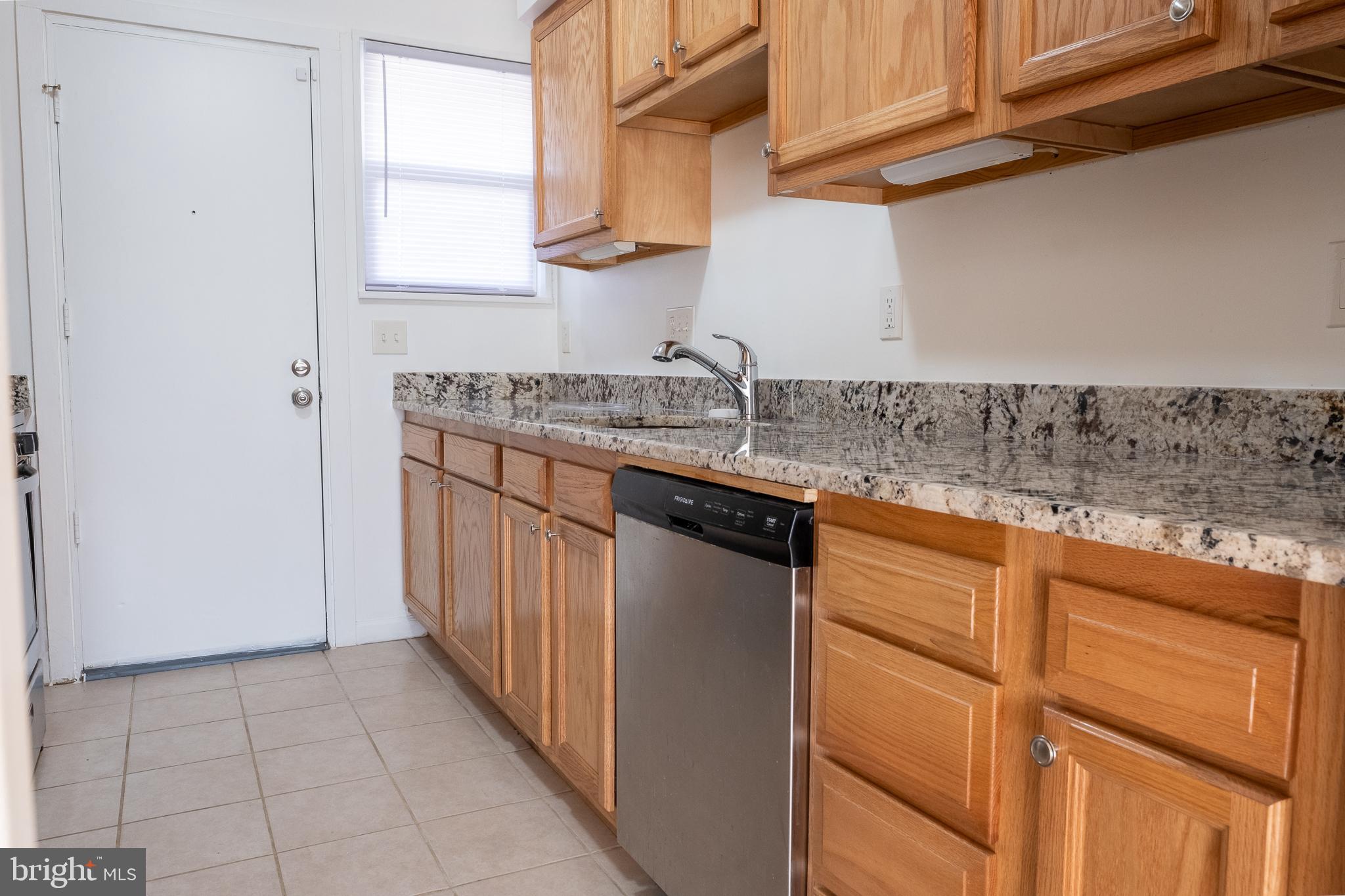 2027 Barlowe Place Landover, MD 20785 - Photo 7 of 20 a kitchen with stainless steel appliances granite countertop a sink and a cabinets