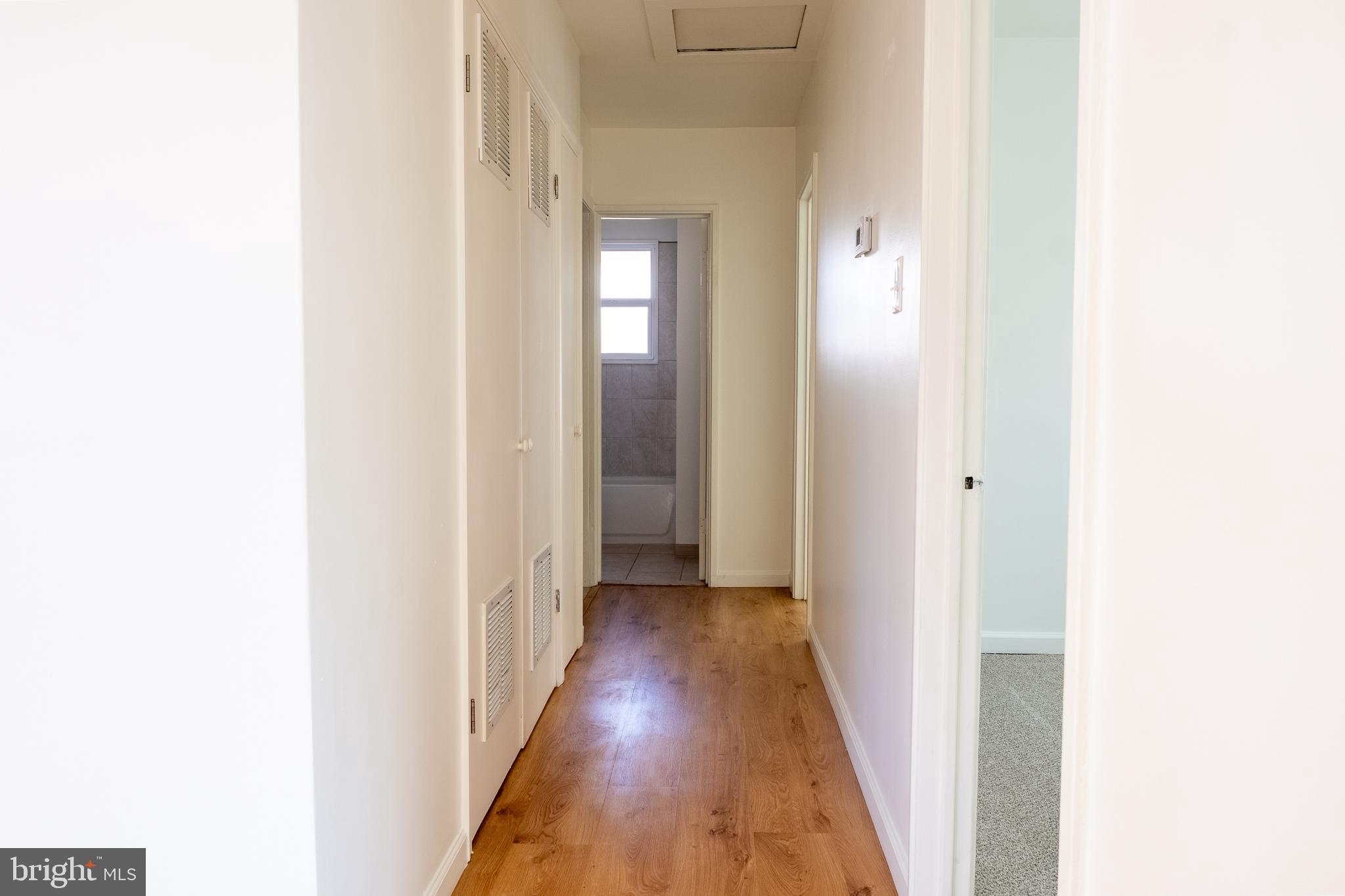 2027 Barlowe Place Landover, MD 20785 - Photo 8 of 20 a view of a hallway with wooden floor