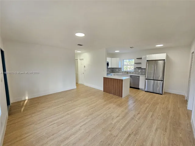 a view of kitchen with wooden floor
