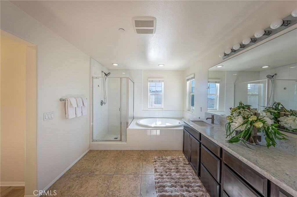 5062 Woodley Ridge Drive Rancho Cucamonga, CA 91739 - Photo 14 of 33 a room with stainless steel appliances a refrigerator and a sink
