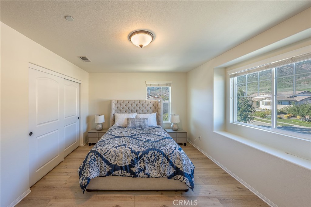 5062 Woodley Ridge Drive Rancho Cucamonga, CA 91739 - Photo 17 of 33 a room with a bed and a window