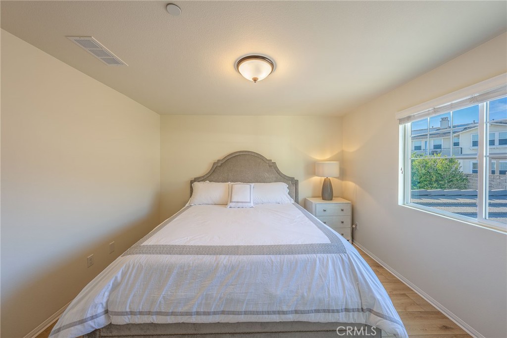 5062 Woodley Ridge Drive Rancho Cucamonga, CA 91739 - Photo 19 of 33 a bedroom with a bed and a window