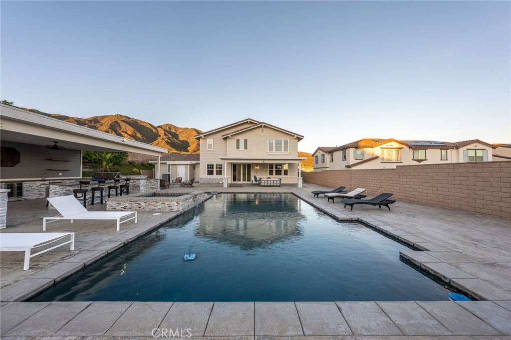 5062 Woodley Ridge Drive Rancho Cucamonga, CA 91739 - Photo 24 of 33 a view of a house with swimming pool