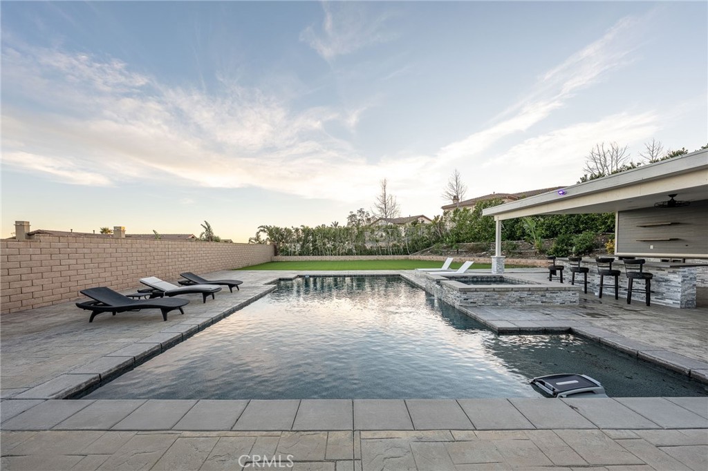 5062 Woodley Ridge Drive Rancho Cucamonga, CA 91739 - Photo 26 of 33 a view of swimming pool with outdoor seating and plants