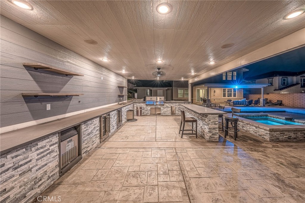 5062 Woodley Ridge Drive Rancho Cucamonga, CA 91739 - Photo 30 of 33 a lobby with furniture and a rug