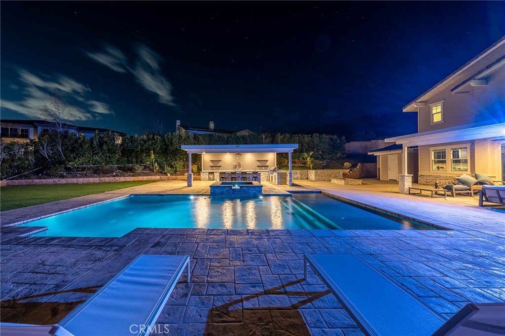 5062 Woodley Ridge Drive Rancho Cucamonga, CA 91739 - Photo 3 of 33 a view of a swimming pool with a patio