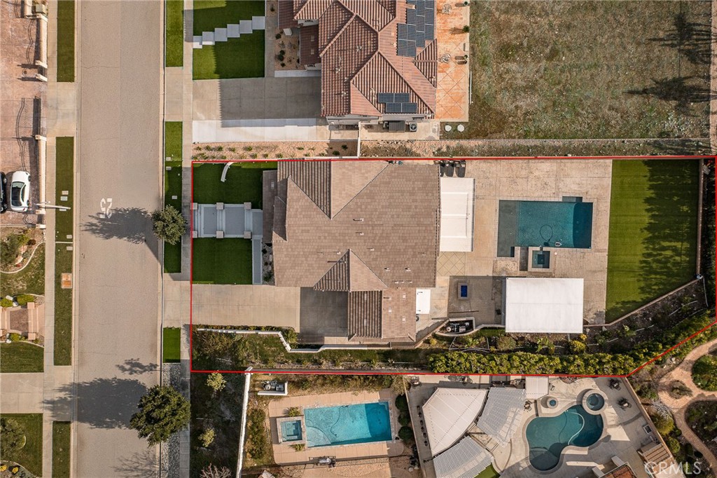 5062 Woodley Ridge Drive Rancho Cucamonga, CA 91739 - Photo 32 of 33 an aerial view of a house with swimming pool