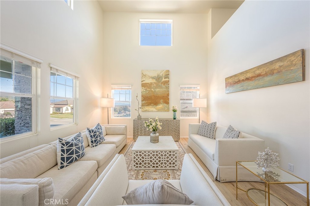 5062 Woodley Ridge Drive Rancho Cucamonga, CA 91739 - Photo 6 of 33 a living room with furniture and a large window