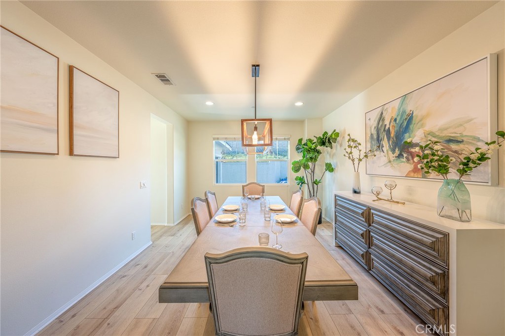 5062 Woodley Ridge Drive Rancho Cucamonga, CA 91739 - Photo 10 of 33 a view of a dining room with furniture window and wooden floor
