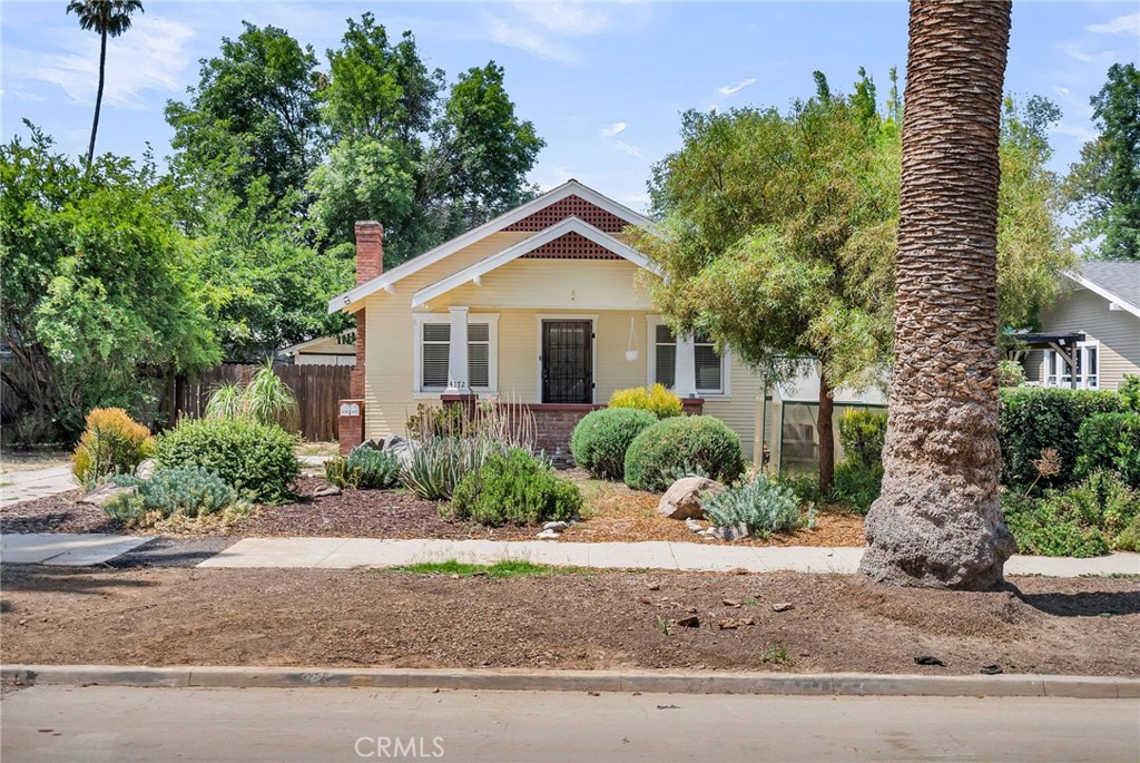 4172 Edgewood Place Riverside, CA 92506 - Photo 1 of 1 a front view of a house with a yard and potted plants
