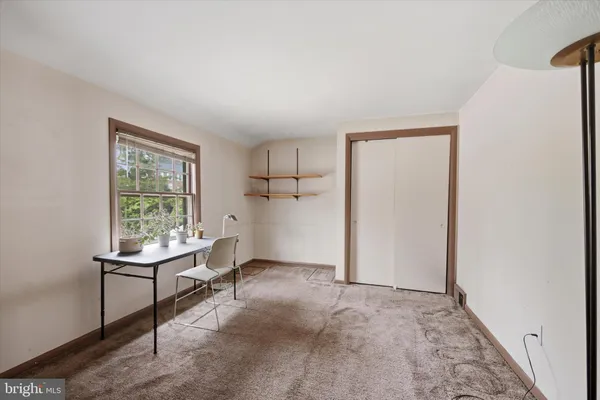 a view of an empty room with a window