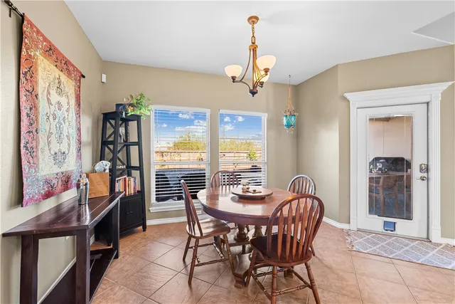 a view of a dining room with furniture window and outside view